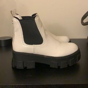 White Sam Edelman boots “circus”